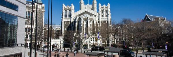 Photo of the CCNY Shepard Hall Building with clear blue skies