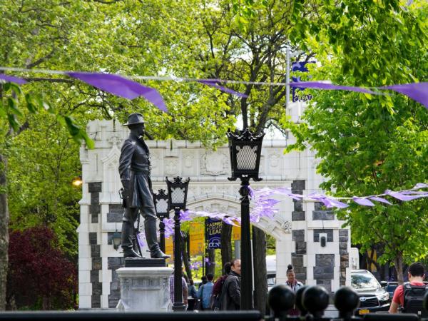 Photo of the CCNY archway when banners are waving