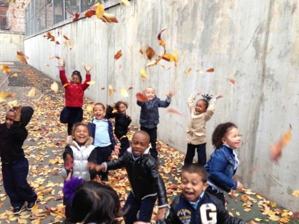 Children playing with leaves