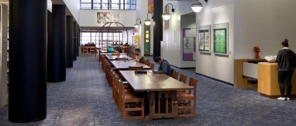 image of students studying at a table in the library