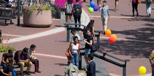 students at the NAC plaza on a sunny day