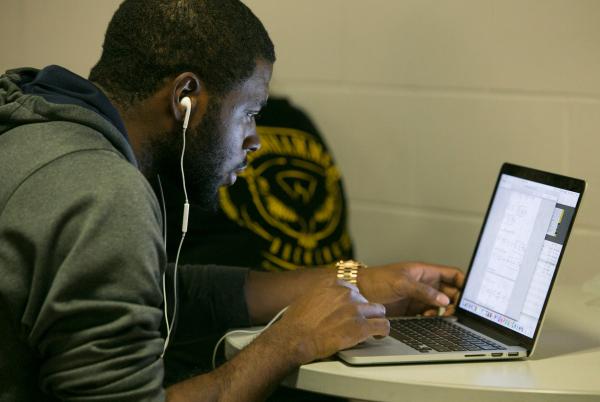 Man on laptop - learn online at ccny