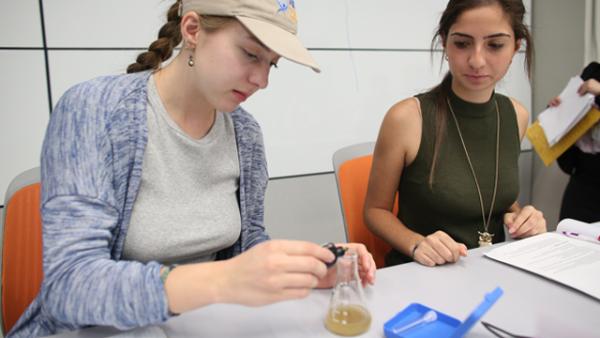 Two students in science class