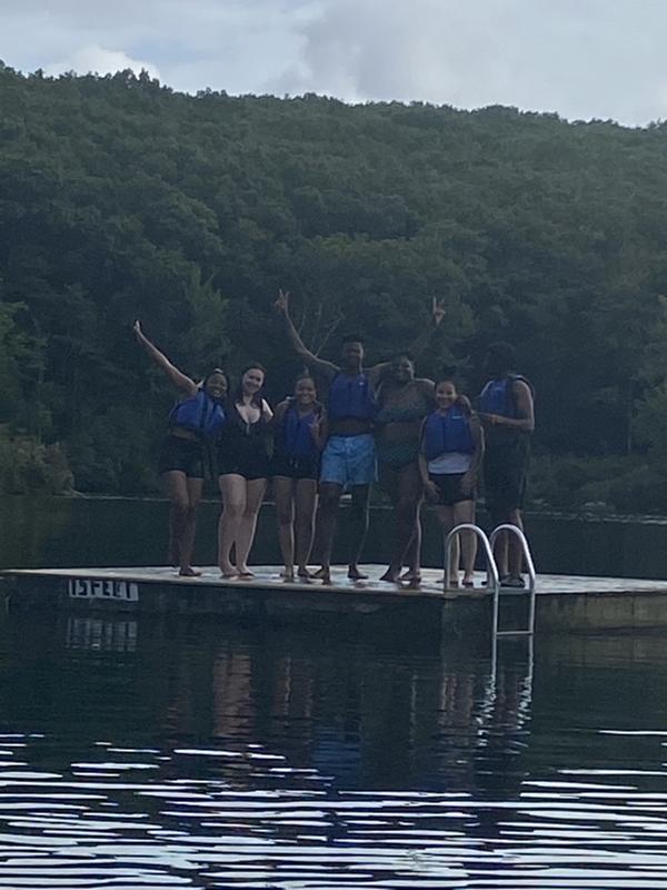 Group of students standing on dock