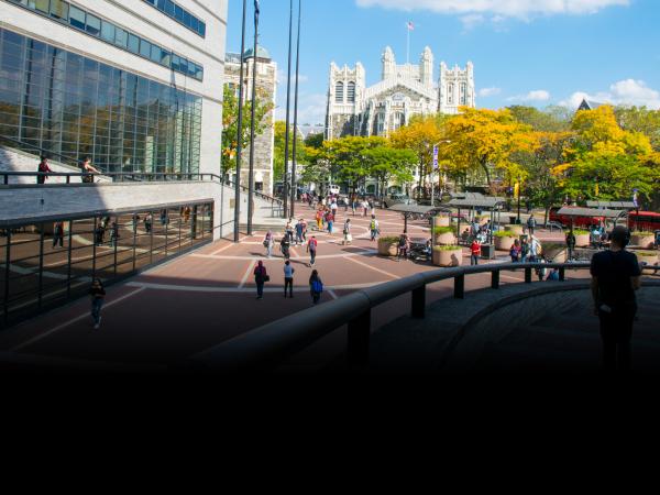 CCNY campus with students in front of the NAC building