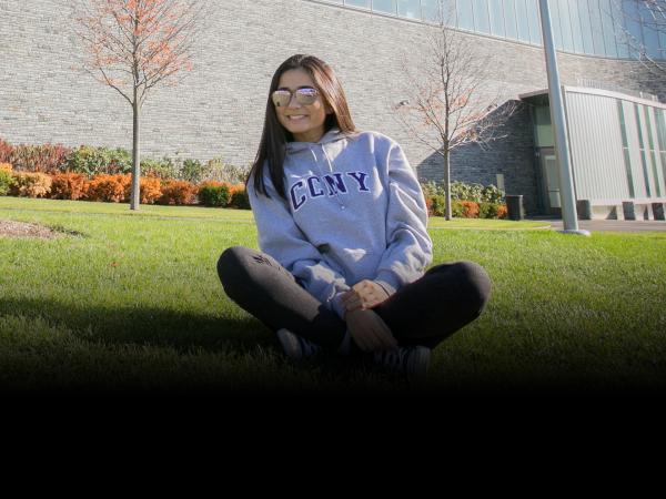 Student sitting on grass 