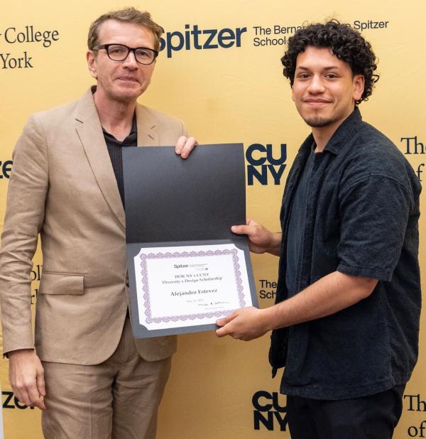 Alejandro Estevez  receives his HOK award from Spitzer School Chair Sean Weiss