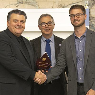 Professor Angelo Lampousis (left) with Tony M. Liss, provost and senior vice president for Academic Affairs, and Travis Murdock, ASTM International.