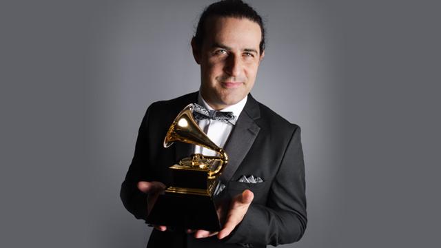 CCNY alumni Dan Pugach '11 with his GRAMMY® award for "Best Large Jazz Ensemble." CCNY private music instructor Pete McCann and CCNY Masters of Music student Nitzan Gavrieli also played on the album.    